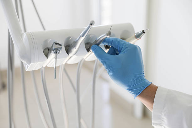 Professional Tooth Extraction technician working in Missouri City, TX